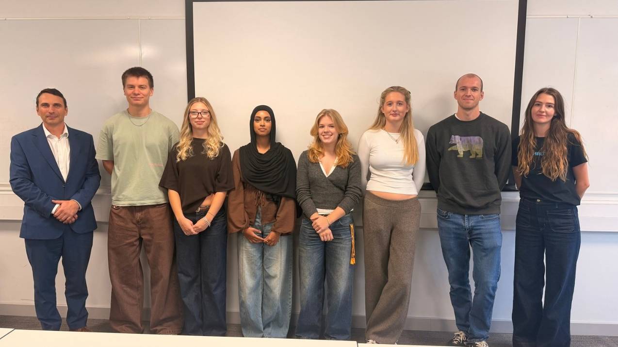 Marek Hornak (far left) and Halo apprenticeships lead Lily Foppa (far right) with Halo apprentices on campus