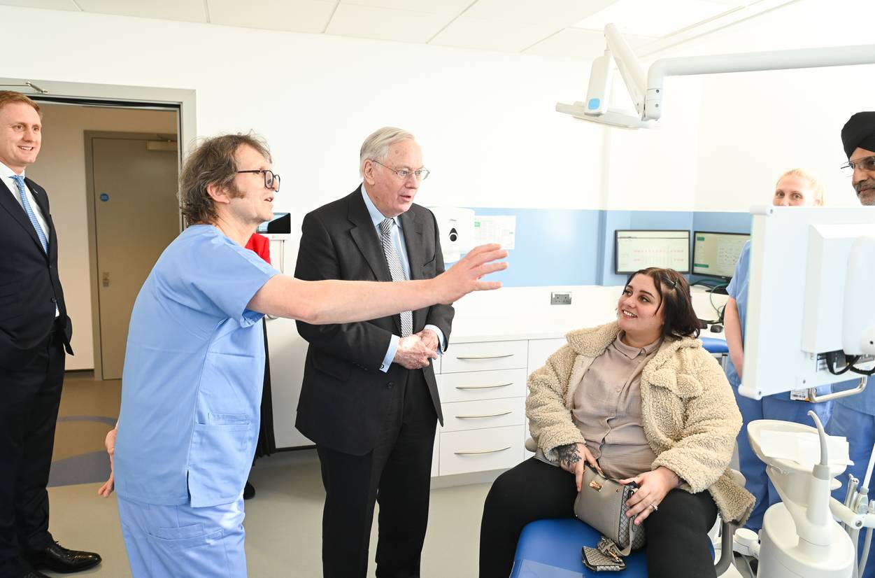 HRH The Duke of Gloucester meets Dental CIC patient Millie O’Donoughoe (seated) and staff from the Dental CIC