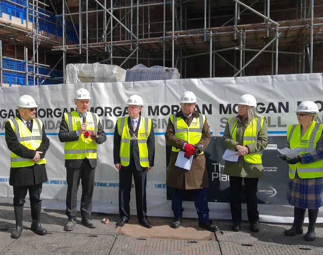 Leaders from the partners involved in The Place gather for the topping out ceremony