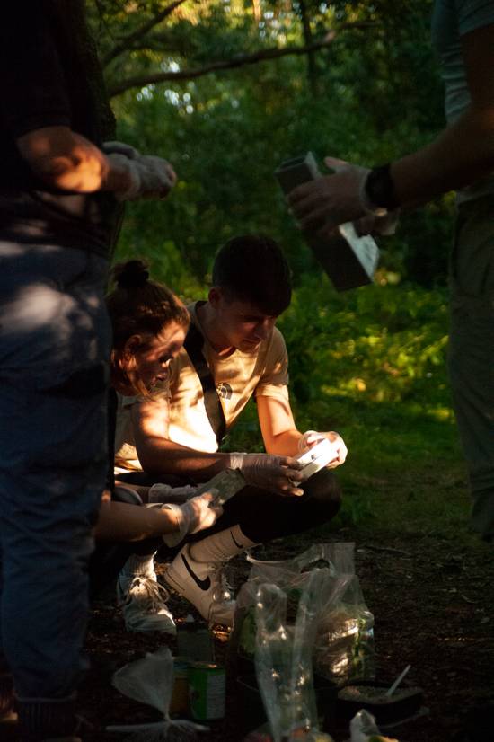 Two students looking at small mammal traps