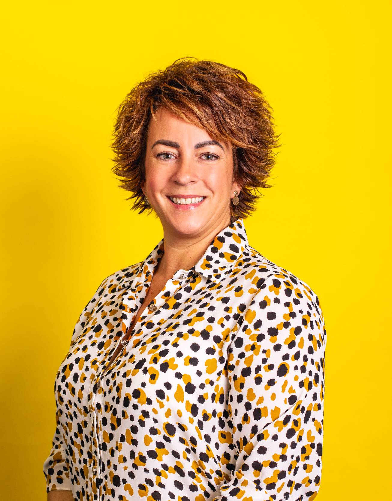 Georgie Andrews profile picture on yellow background