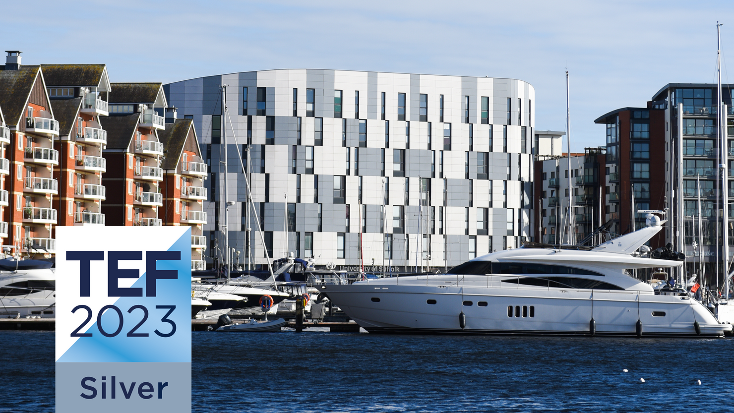 A photo of the Waterfront Building with a graphic of the TEF silver rating superimposed on it