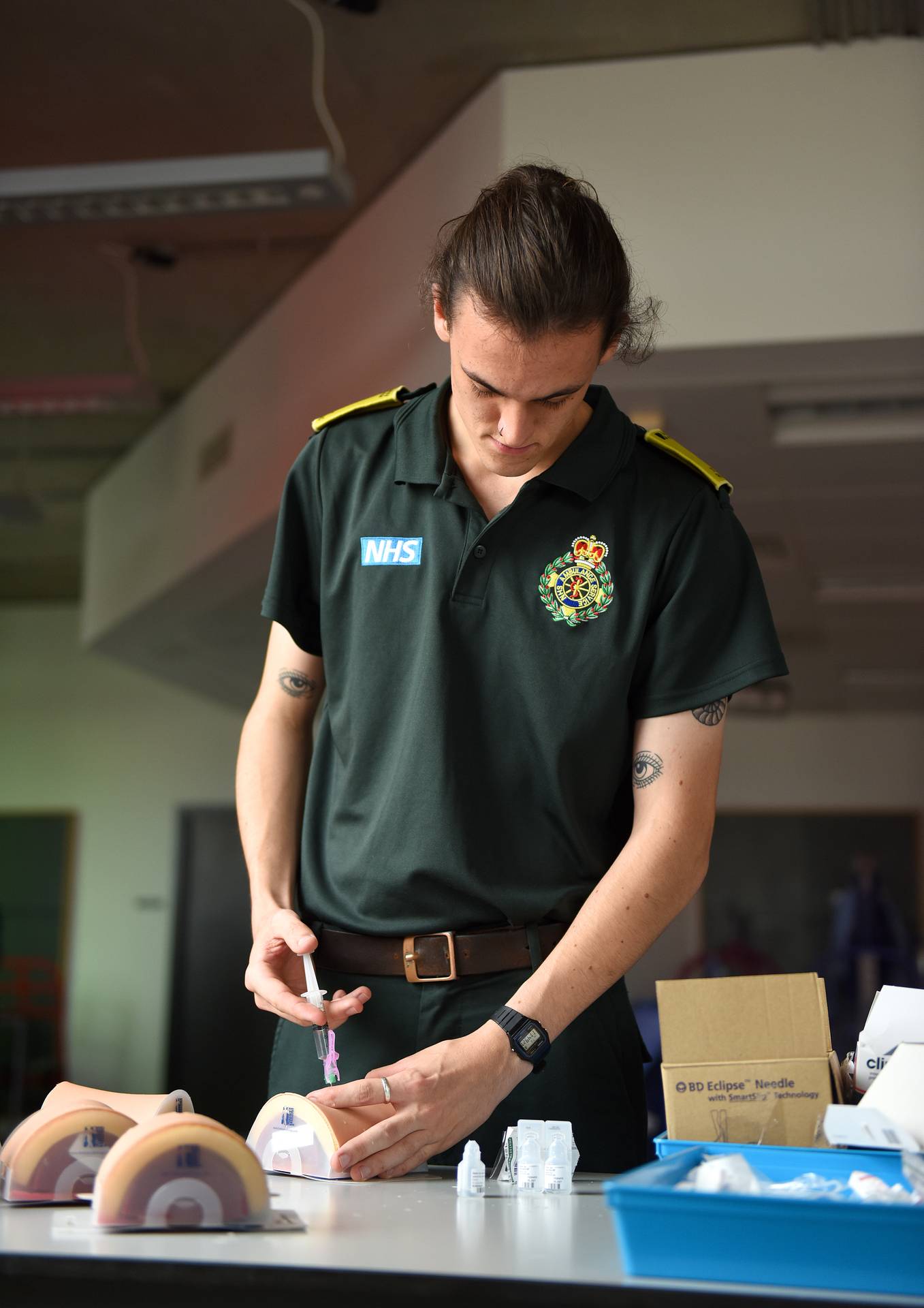 A student paramedic with syringe