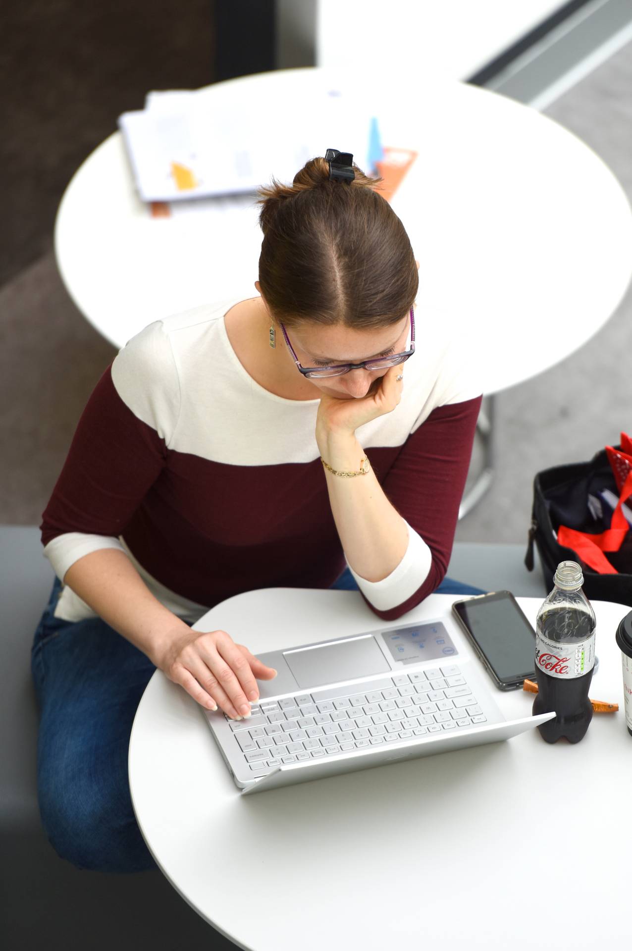 A student sitting and working on a laptop