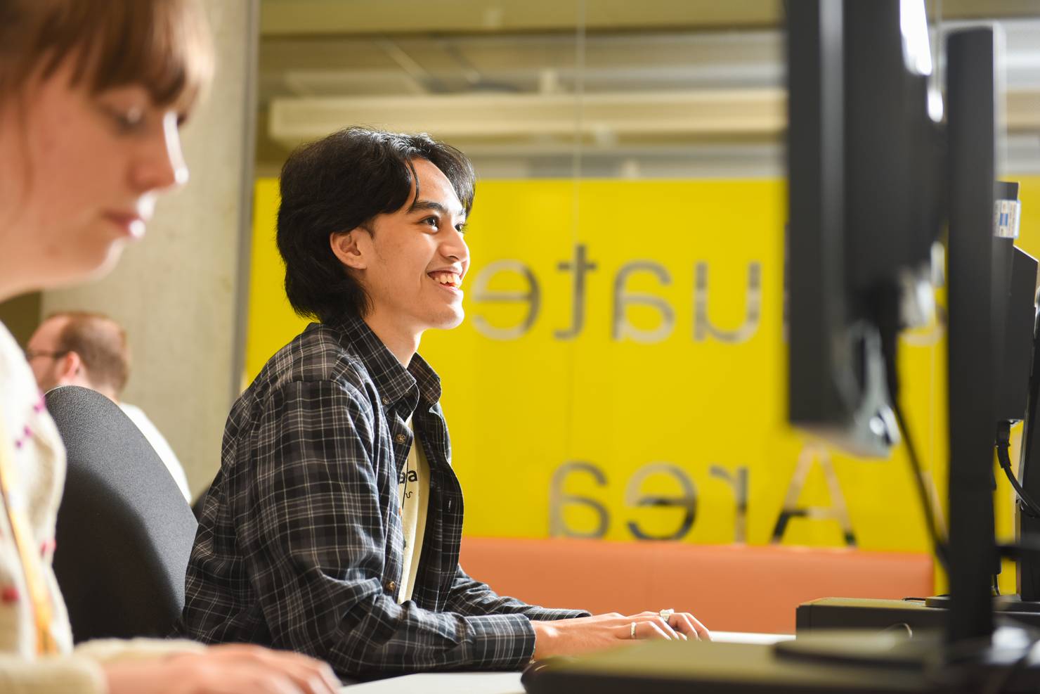 A student sitting at a computer