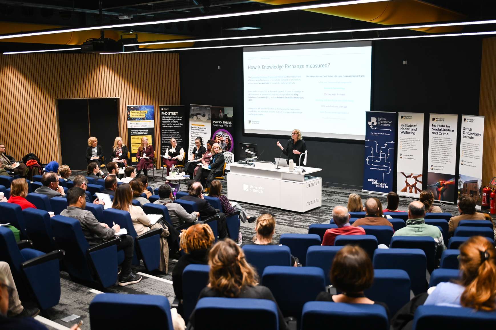 A lecture theatre filled with listeners to a panel event at the first Unlocked event