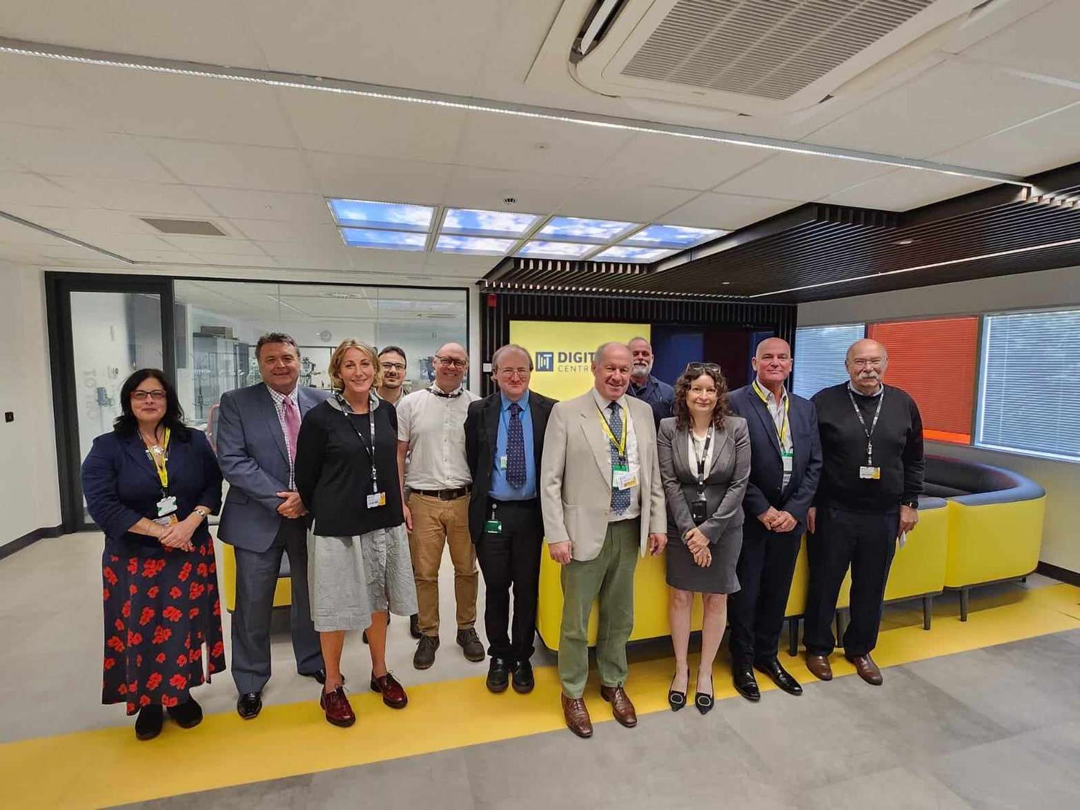 PCC Tim Passmore and members of staff and academics at the DigiTech Centre gathered together in the DigiTech's open space