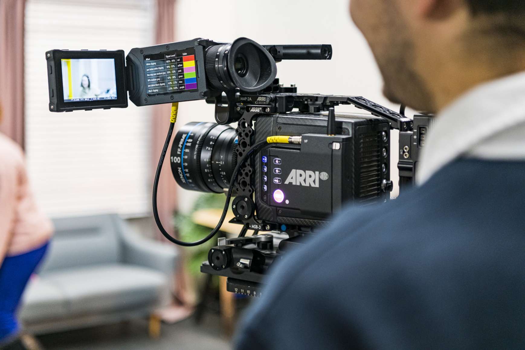 A close up image of a camera being operated by a student