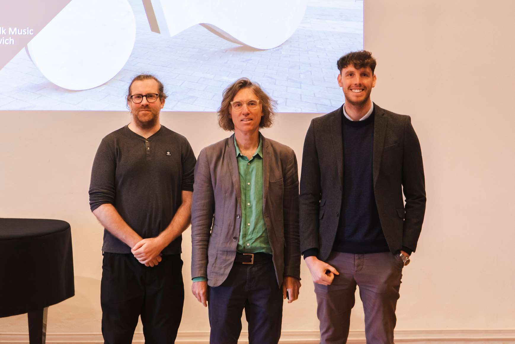 University of Suffolk academics David Atkins, David James and Phil Nicholson. presenting a powerpoint presentation at Snape Maltings on their music education in Suffolk report.