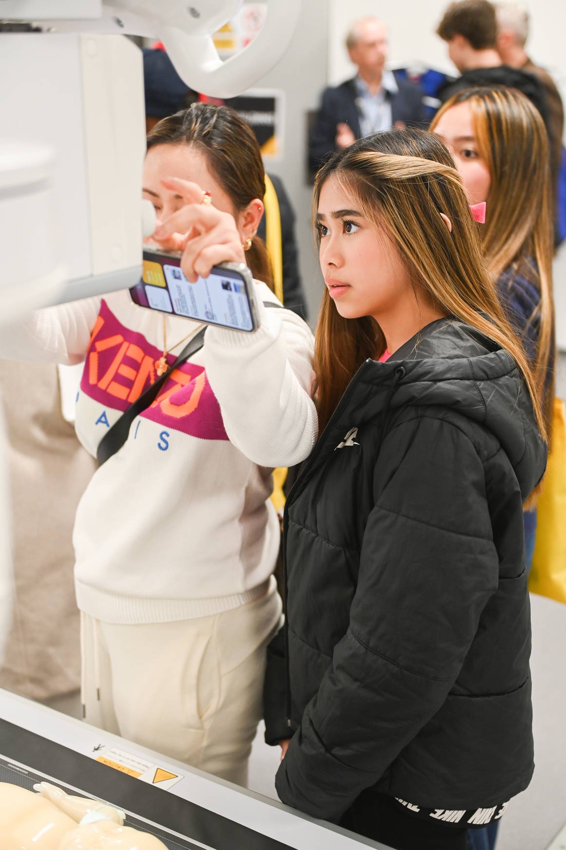 Students looking at radiography equipment