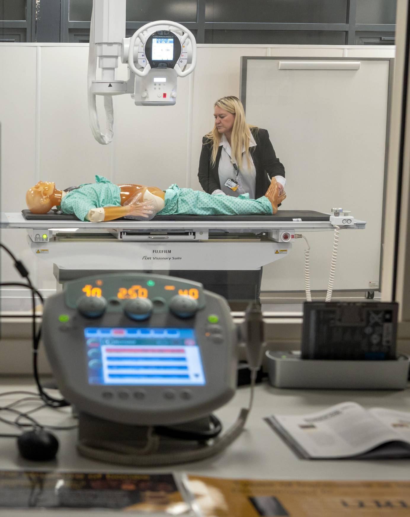 Radiography lecturer using imaging equipment