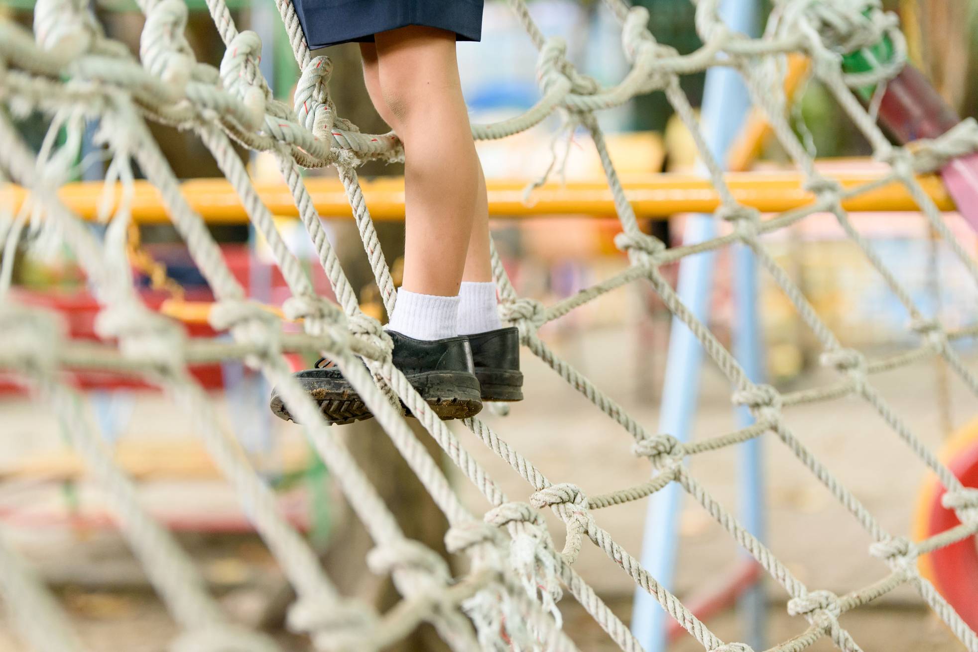 Rope net climbing frame in a playground