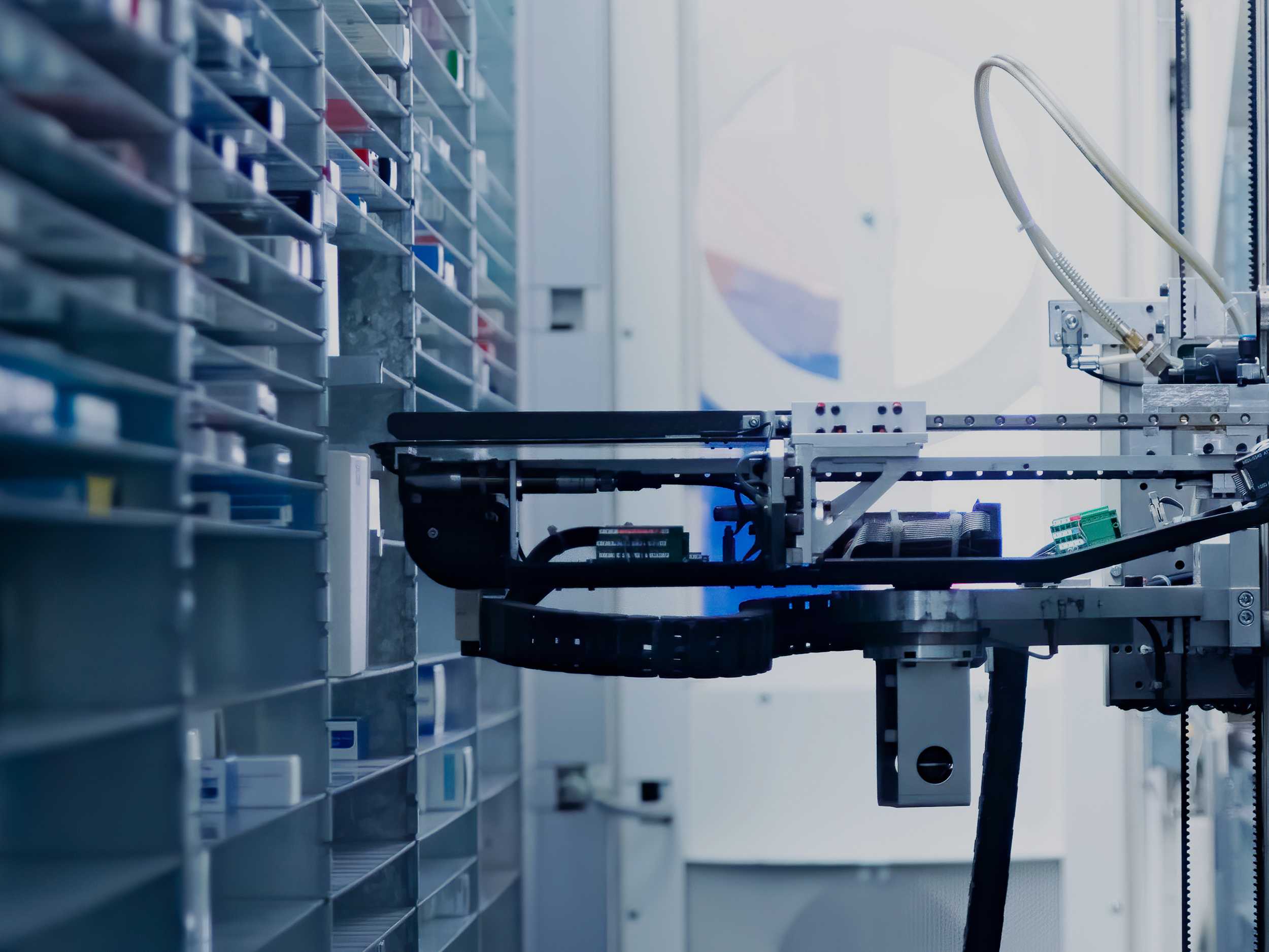 Modern pharmacy storage room with a robot hand arranging and storing out drugs in a pharmacy