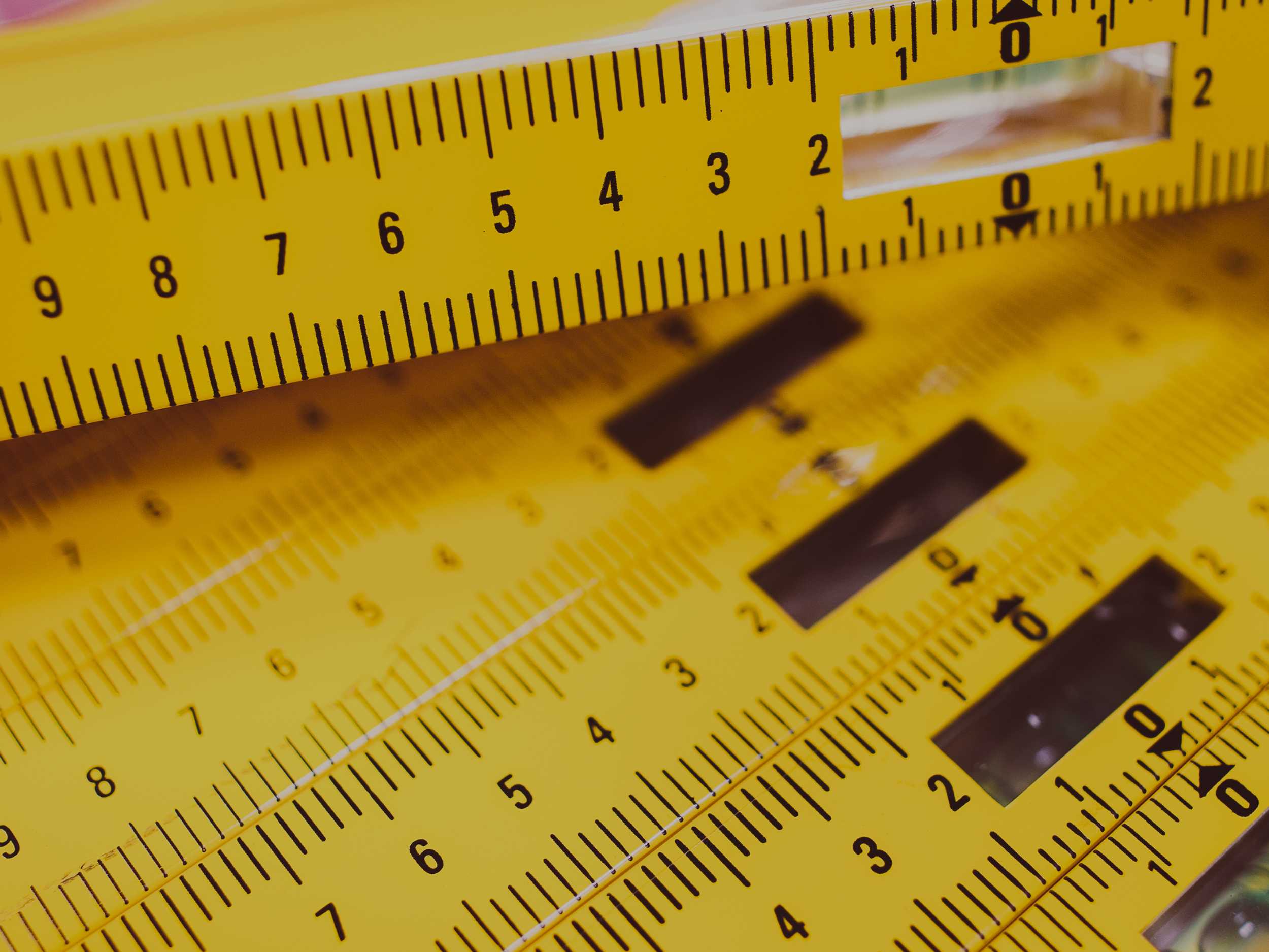 Closeup of construction level rulers