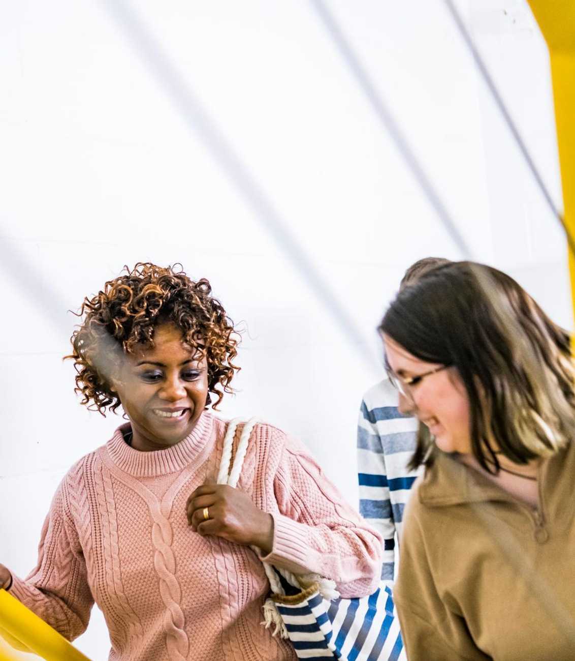 Two students walking up the stairs