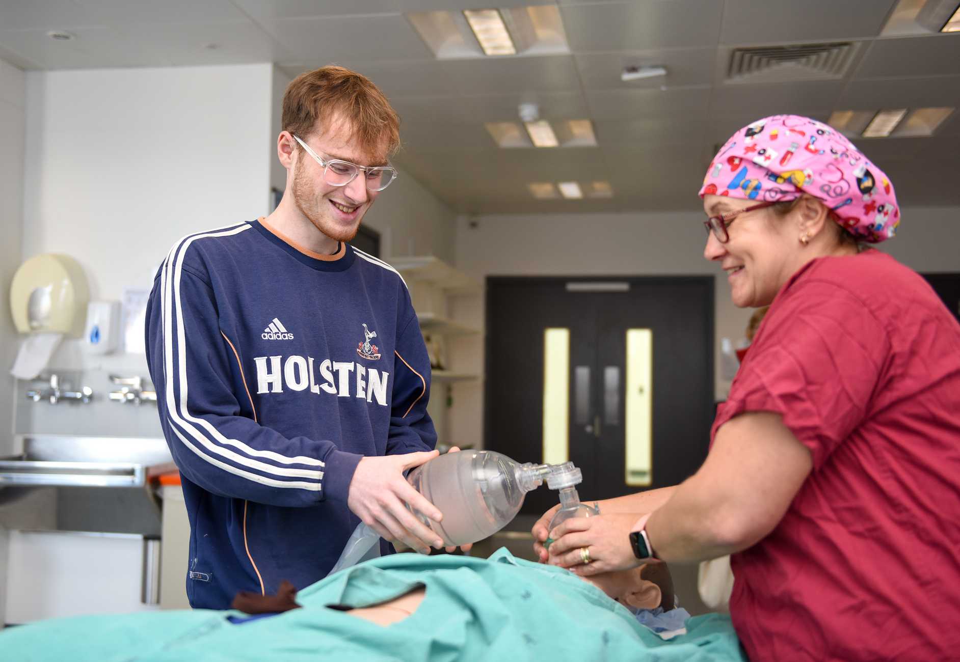 A student using a manual resuscitator bag