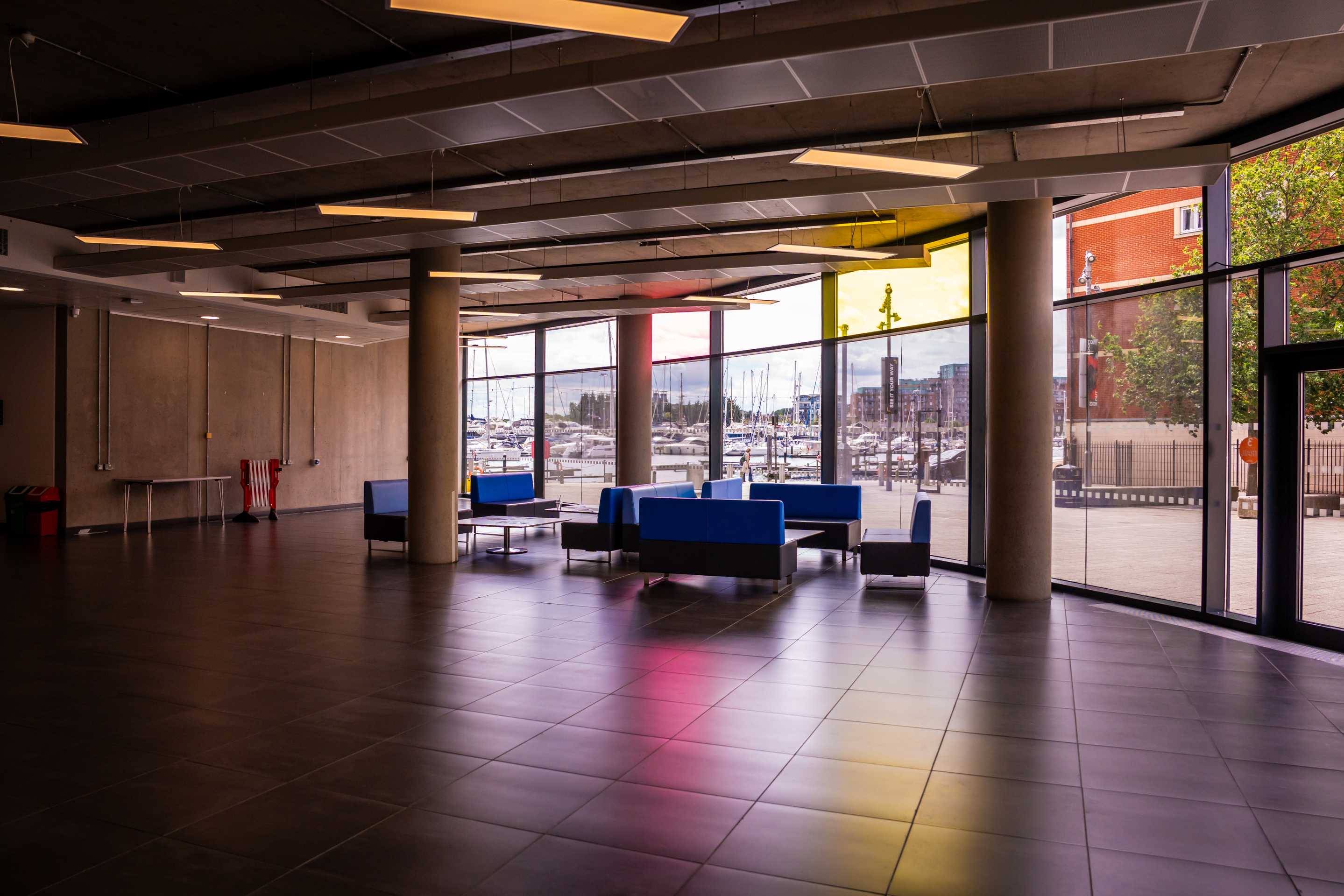 Interior view from inside Waterfront Building foyer, sunlight reflecting on the floor.