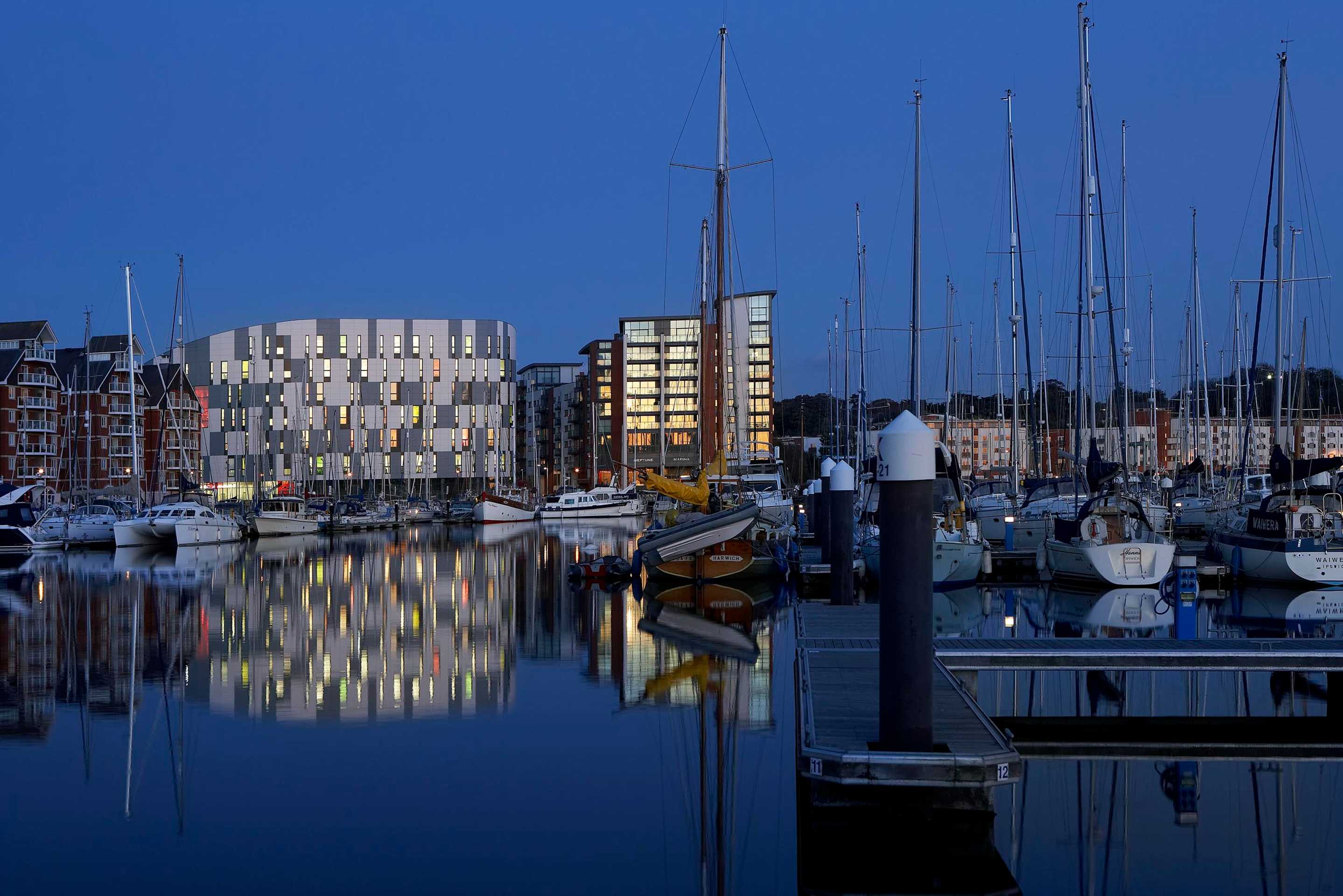 Waterfront Building reflecting in the marina