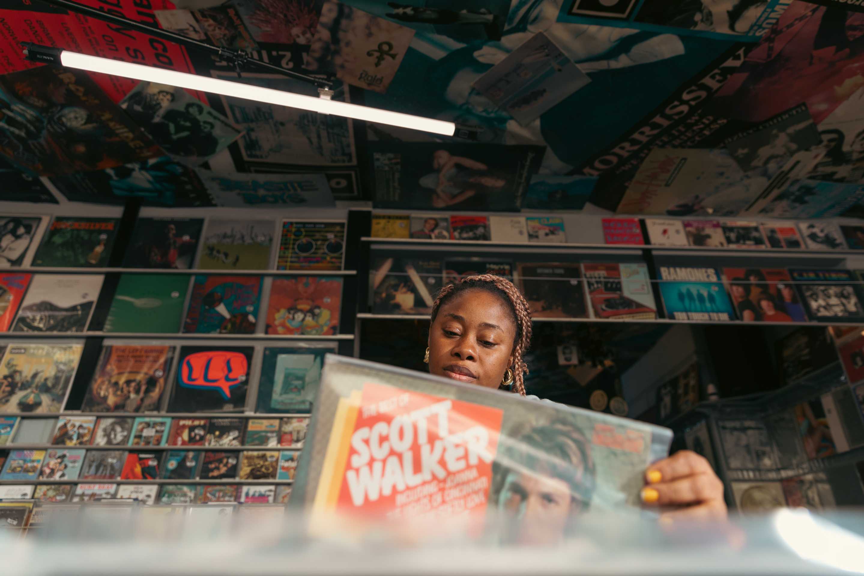 Woman browsing in a record shop