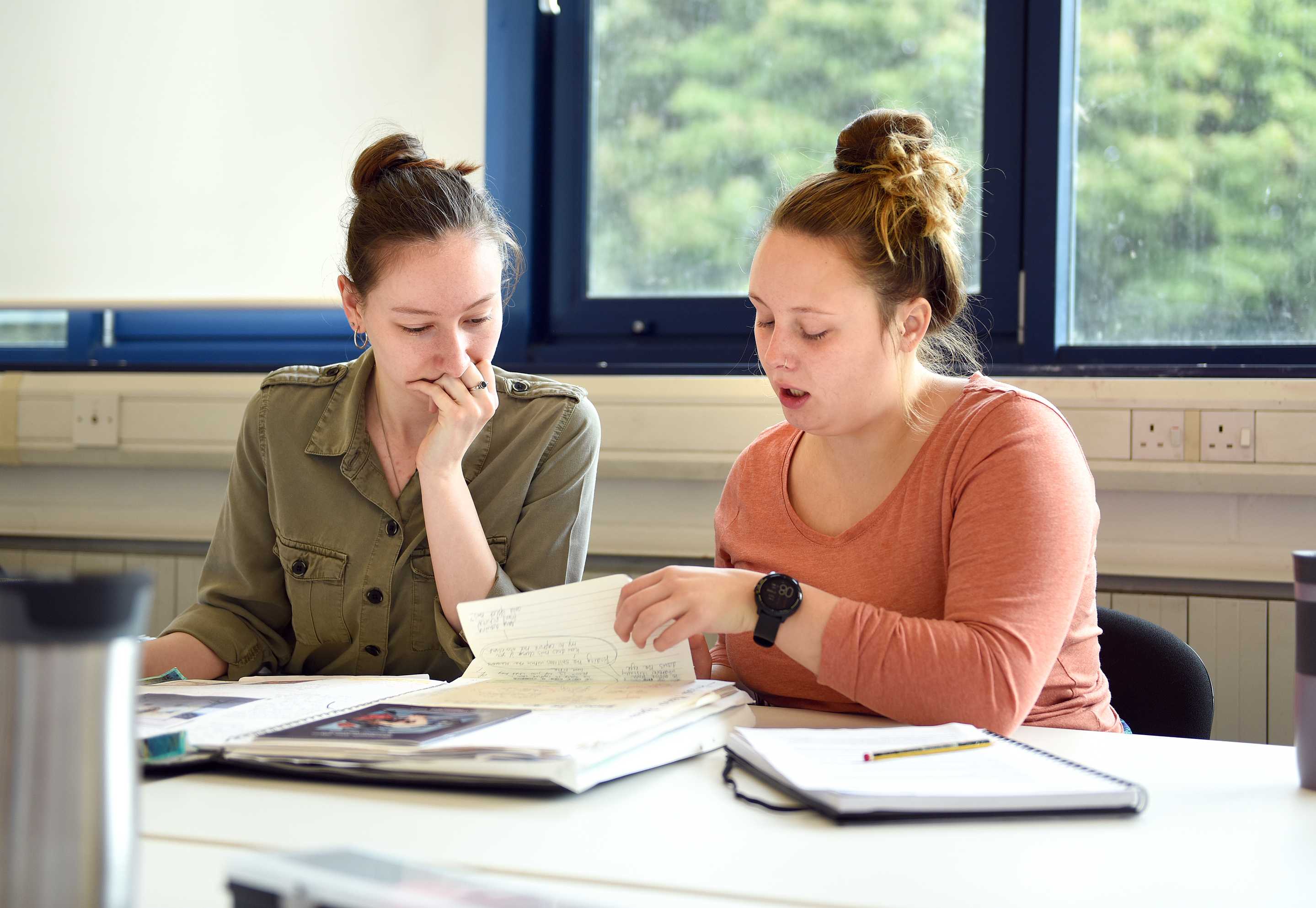 Two students reviewing their working