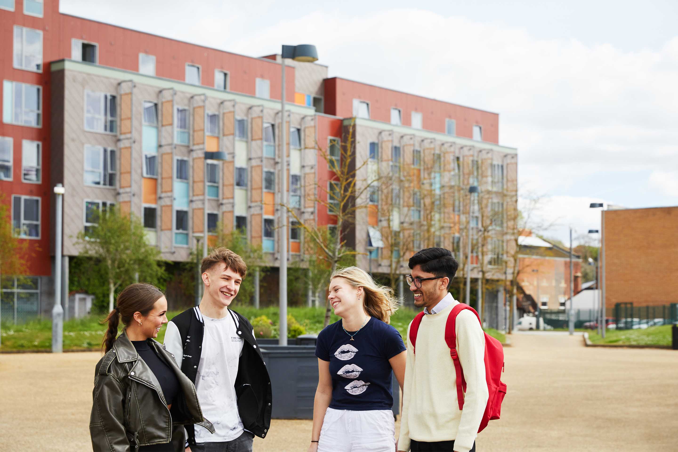 Group of students outside university buildings