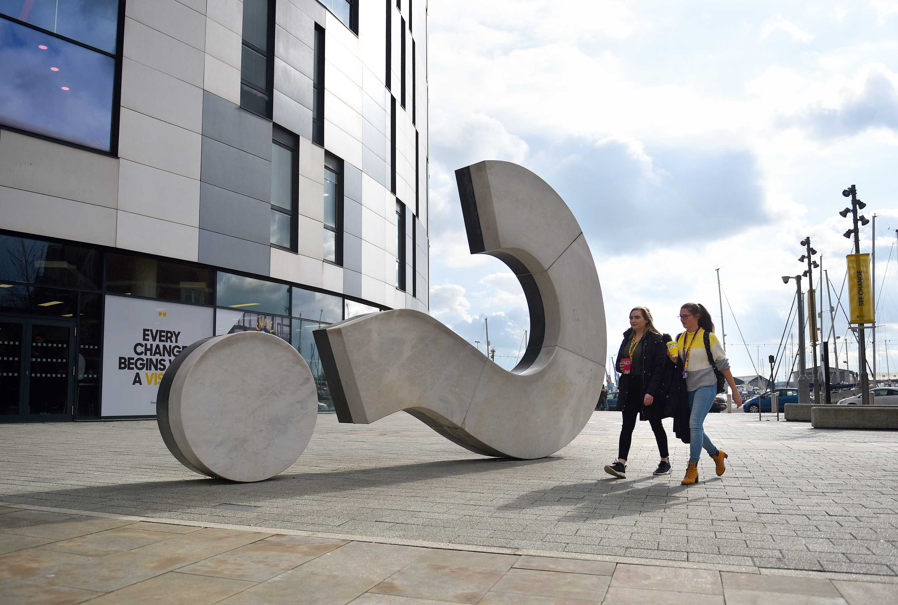 Students walking outside the University of Suffolk building