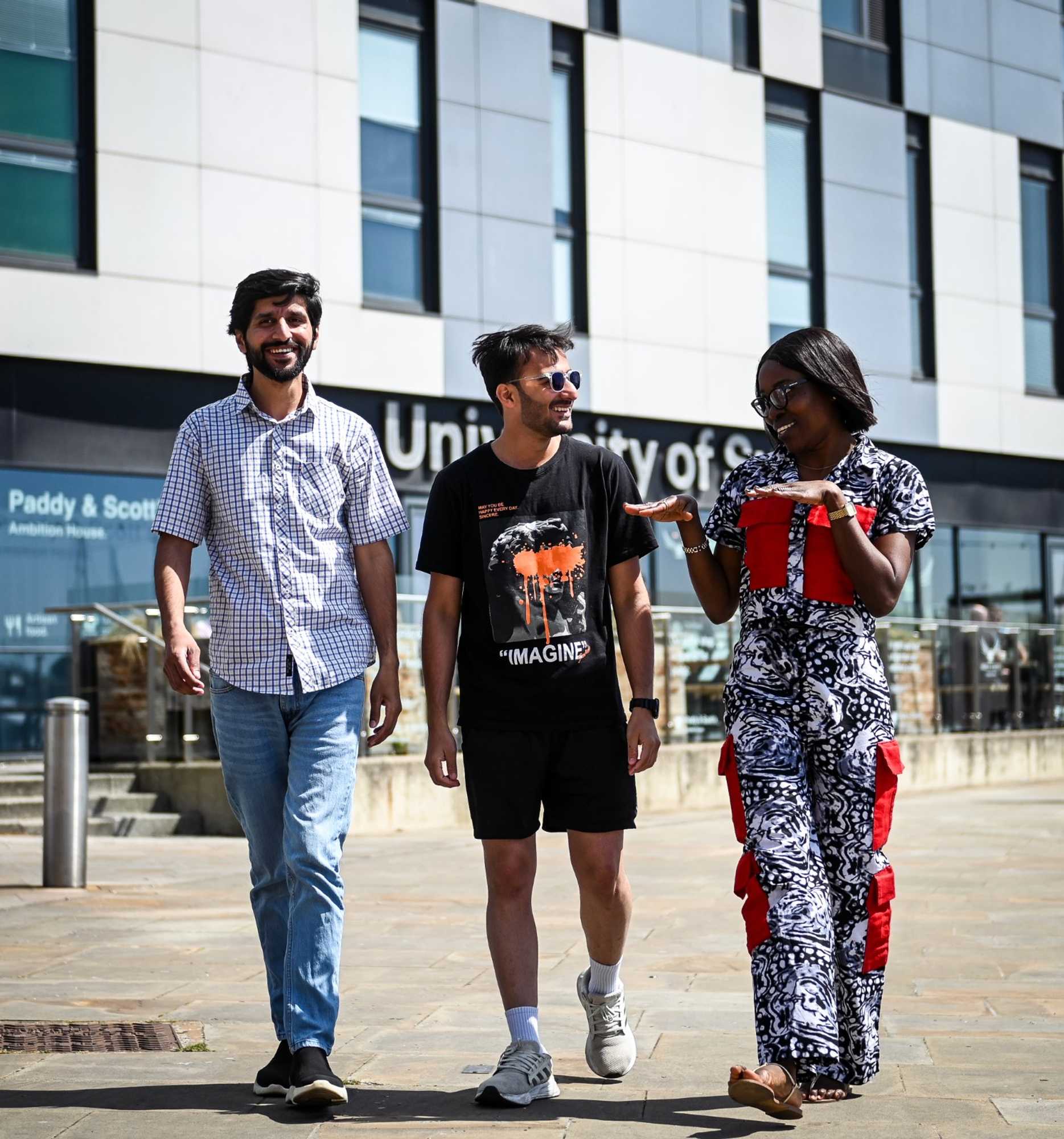 Students walking and chatting outside Waterfront Building