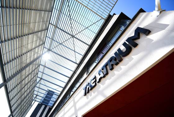 The outside of The Atrium building looking up at the sign