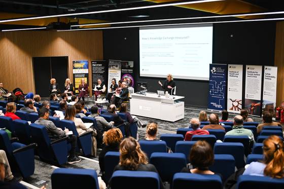 A lecture theatre filled with listeners to a panel event at the first Unlocked event