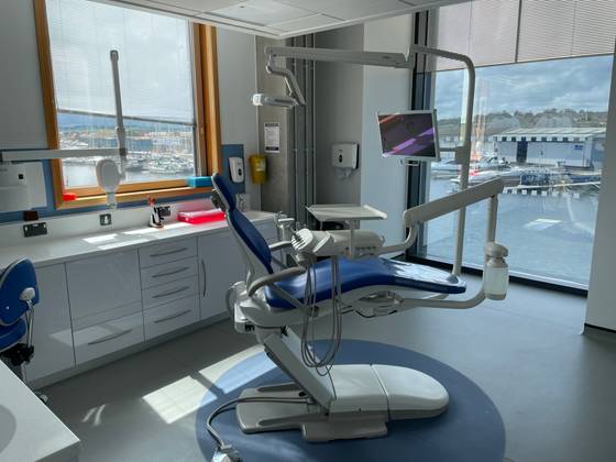 One of the Dental CIC treatment rooms. Visible is a treatment chair and clinical equipment