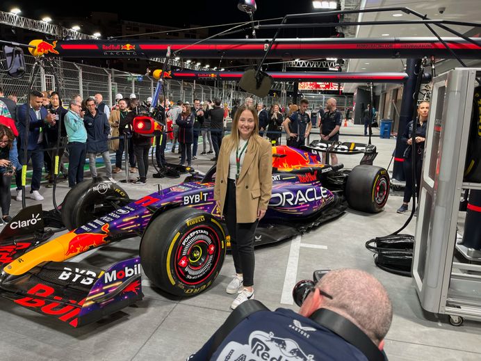 woman with F1 car