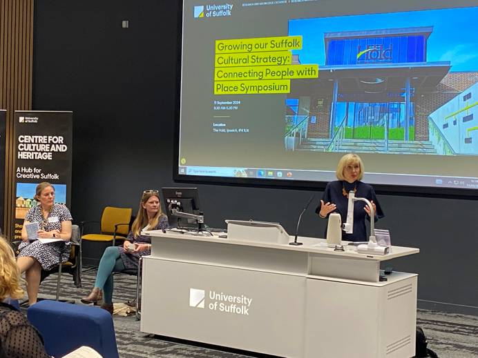 Professor Jenny Higham addresses an audience in a lecture theatre