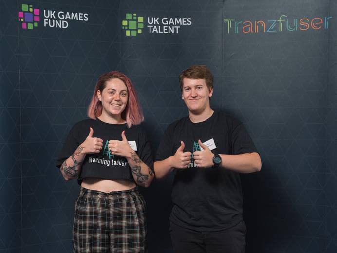 Left to right: Hannah Bull and Daniel Wiltshire from Alarming Ladder Studios smiling with thumbs up. The pair are headed to EGX, the largest gaming convention in the UK