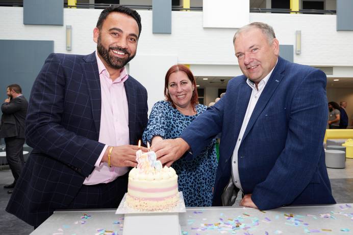 Gurpreet Jagpal, Emma Wakeling and Peter Basford in The Atrium cutting a cake to celebrate the ILABS 1st birthday