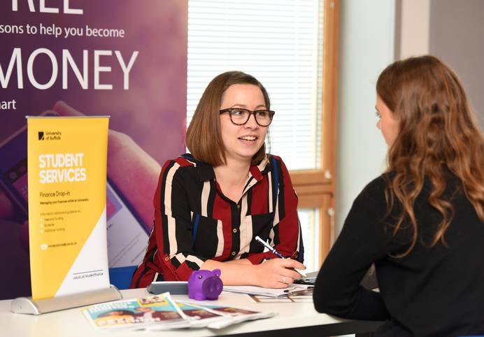 Student talking about finance with a member of staff
