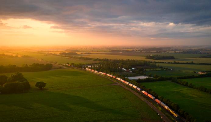 An aerial view across fields at sunset