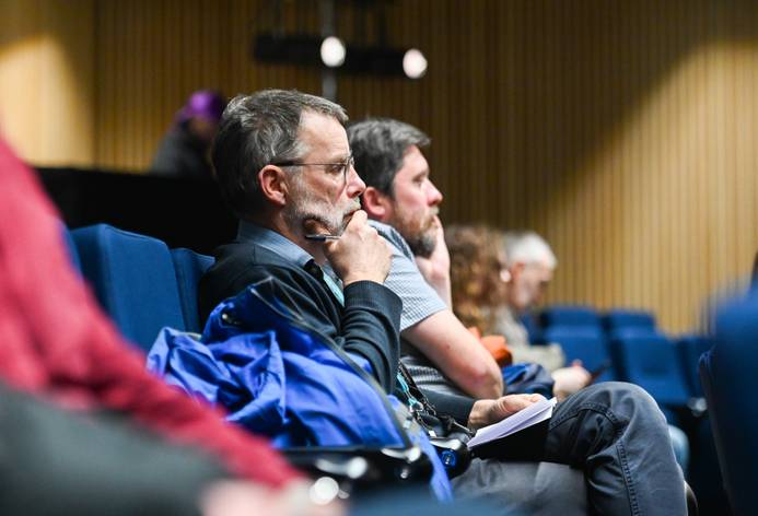 People sitting and listen in and lecture theatre