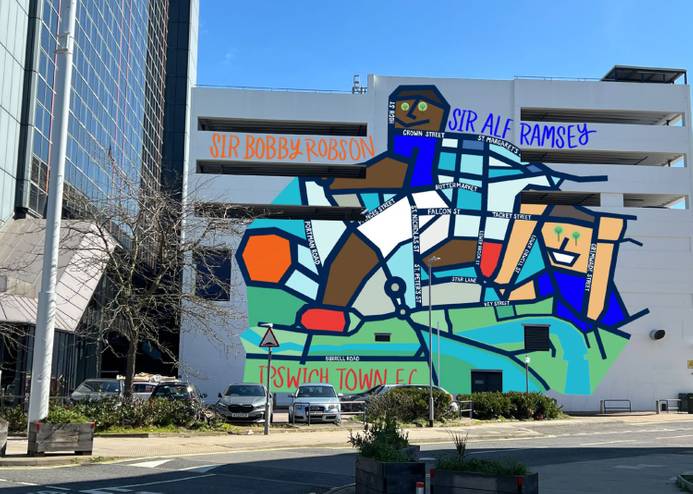 Artwork created by Sammi Wong. It features a footballer kicking a ball but illustrated as a map, and superimposed on the side of a multi-storey car park in Ipswich