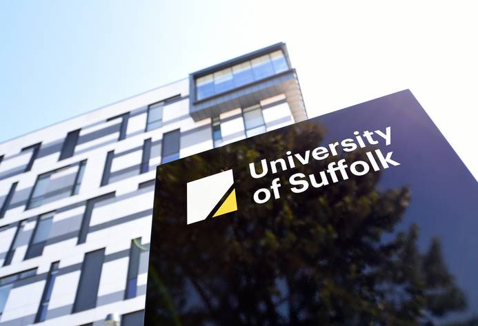 A photo of the University of Suffolk sign outside the James Hehir Building