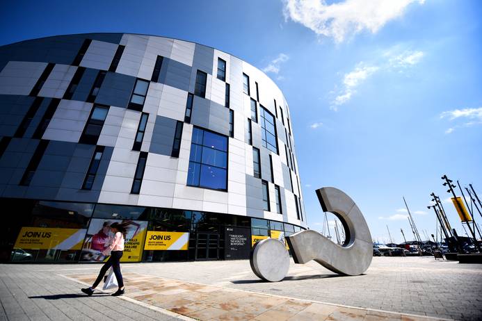 The outside of the Waterfront Building at the University of Suffolk on a sunny day
