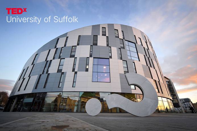 The outside of the University of Suffolk waterfront Building at sunset. The words in the top left include the TEDx logo and 'University of Suffolk'