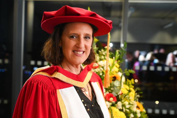 A head and shoulders photo of Karen Pickering MBE, dressed in graduation robes at her graduation ceremony at the University of Suffolk