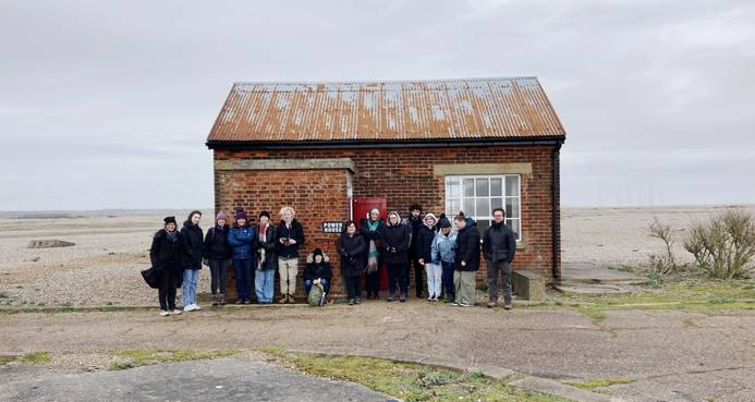 Staff and students from the Fine Art course outside the Power House exhibit on Orford Ness