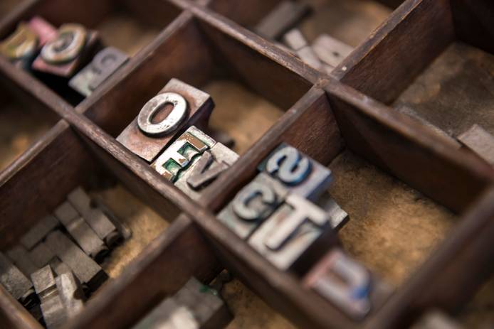 Close-up of metal letterpress printing blocks