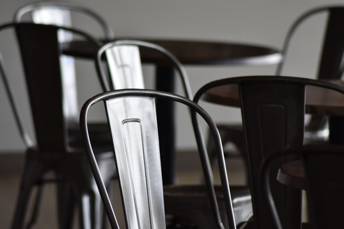 Close-up of chairs in cafe