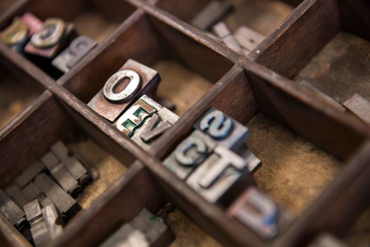 Close-up of metal letterpress printing blocks