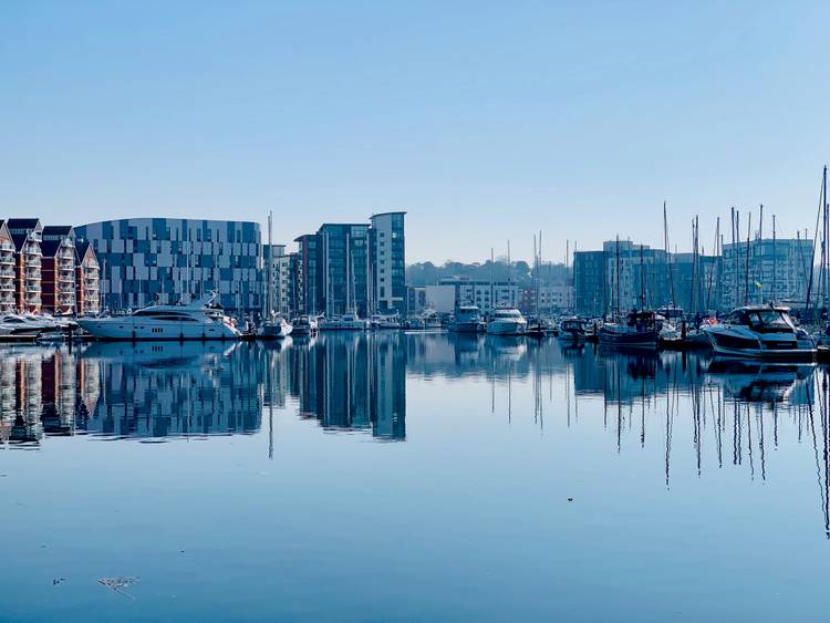 Waterfront Building reflecting in the marina