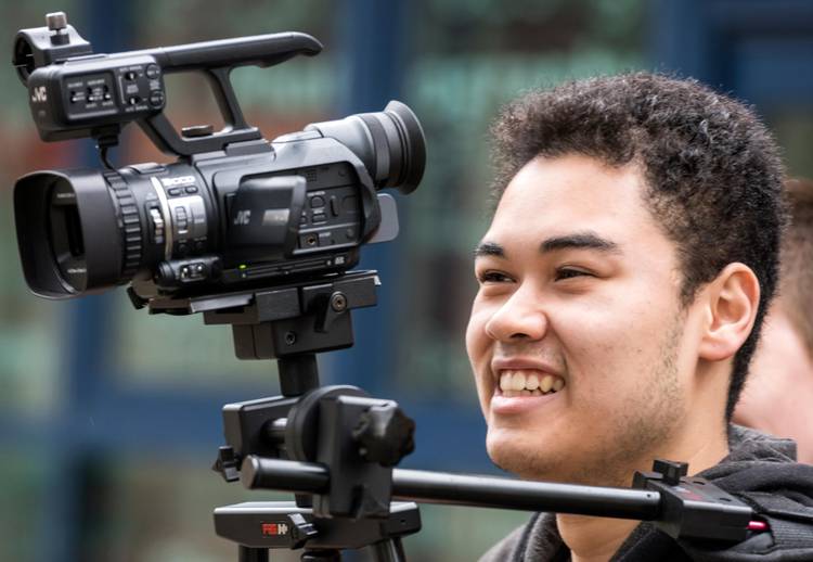 Close-up of student with video camera