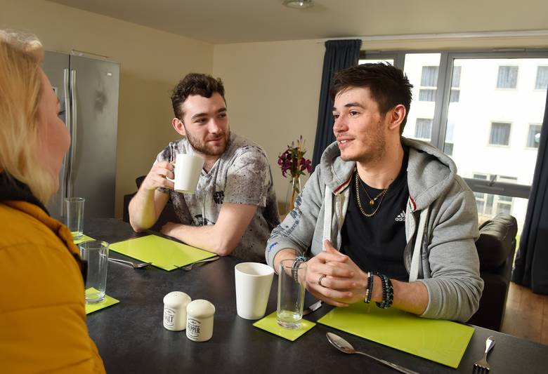 Two students sitting at a dining table