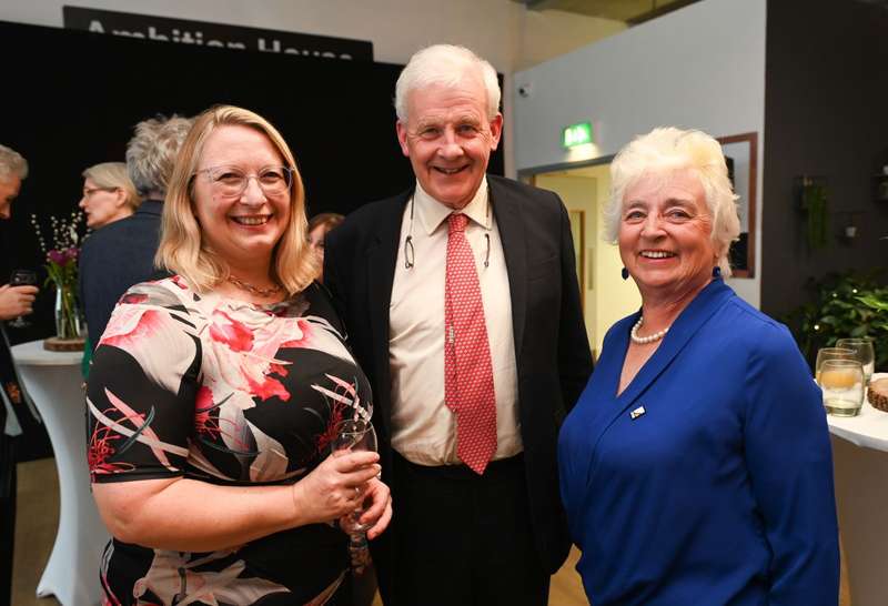 People smile while celebrating Alumni Connection Week at the supporters drinks reception